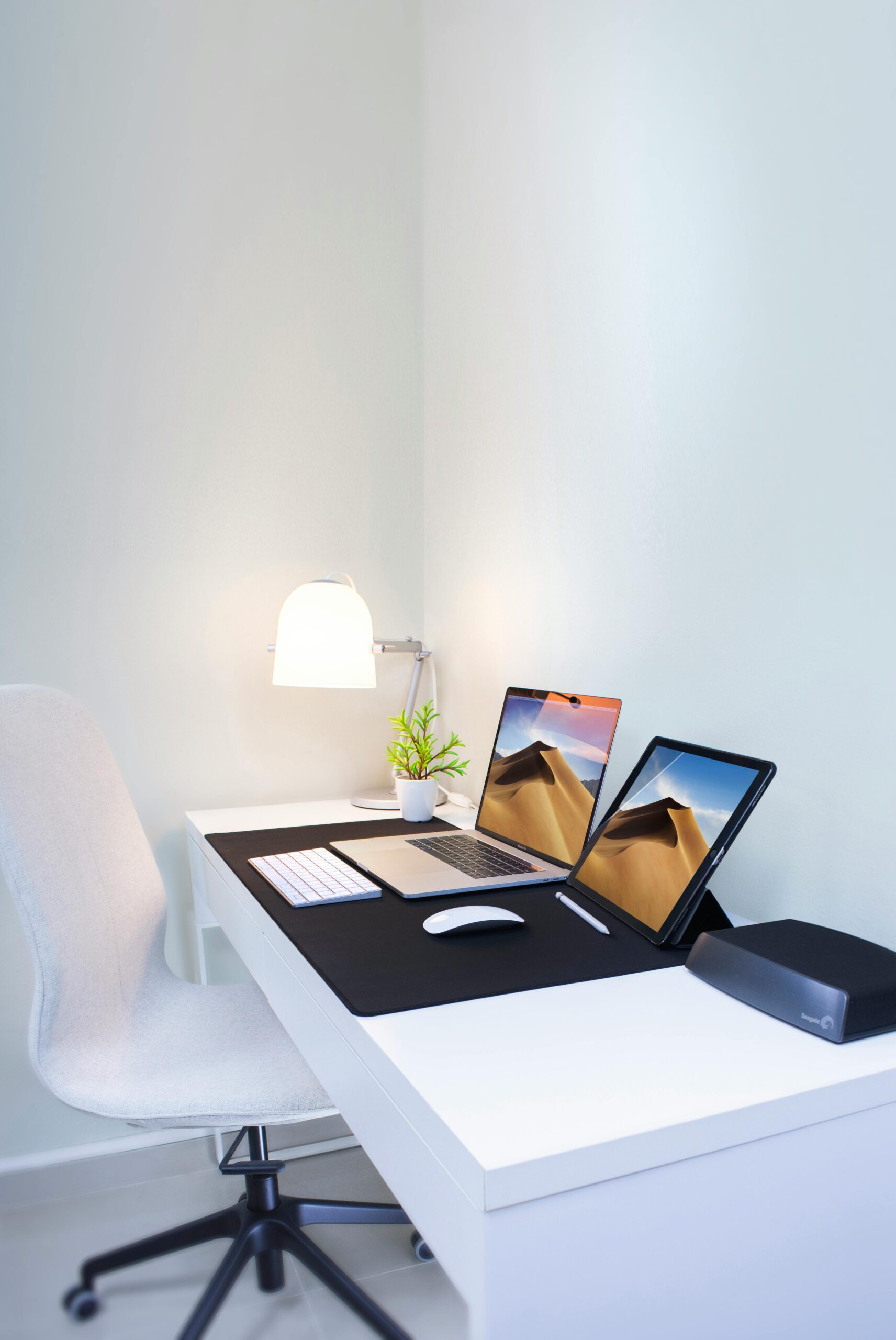Projects Stylish home office desk with dual screens and minimalist decor. Perfect for remote work and productivity.
